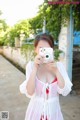 A woman taking a picture of herself with a camera.