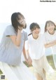 A group of young women standing next to each other on a field.